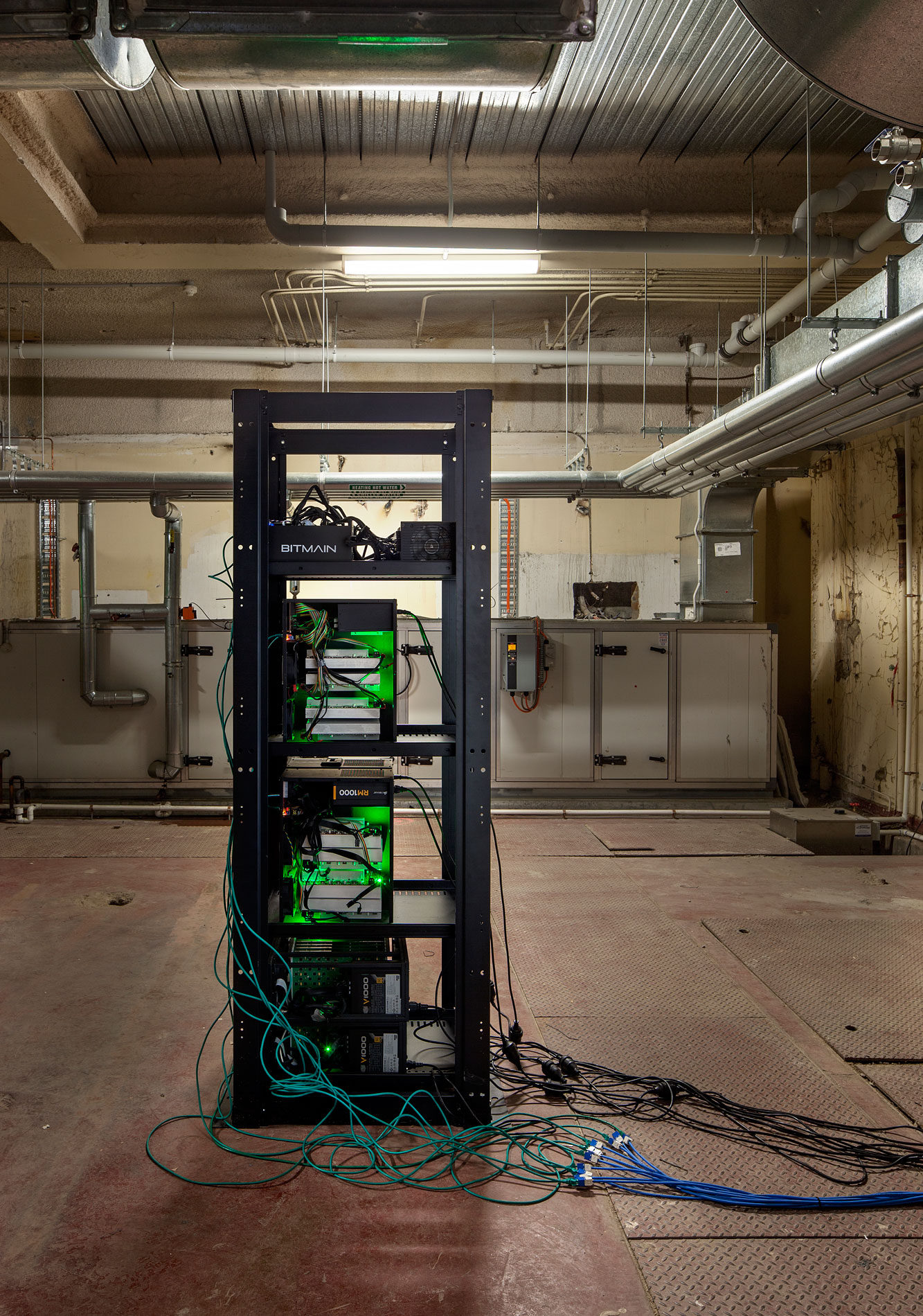 Nicholas Mangan, *Limits to Growth*, 2016, 9 terrahash Bitcoin ASIC mining rig. Installation detail, basement boiler room of Monash University Museum of Art, Melbourne, 2016. Photographer: Andrew Curtis.