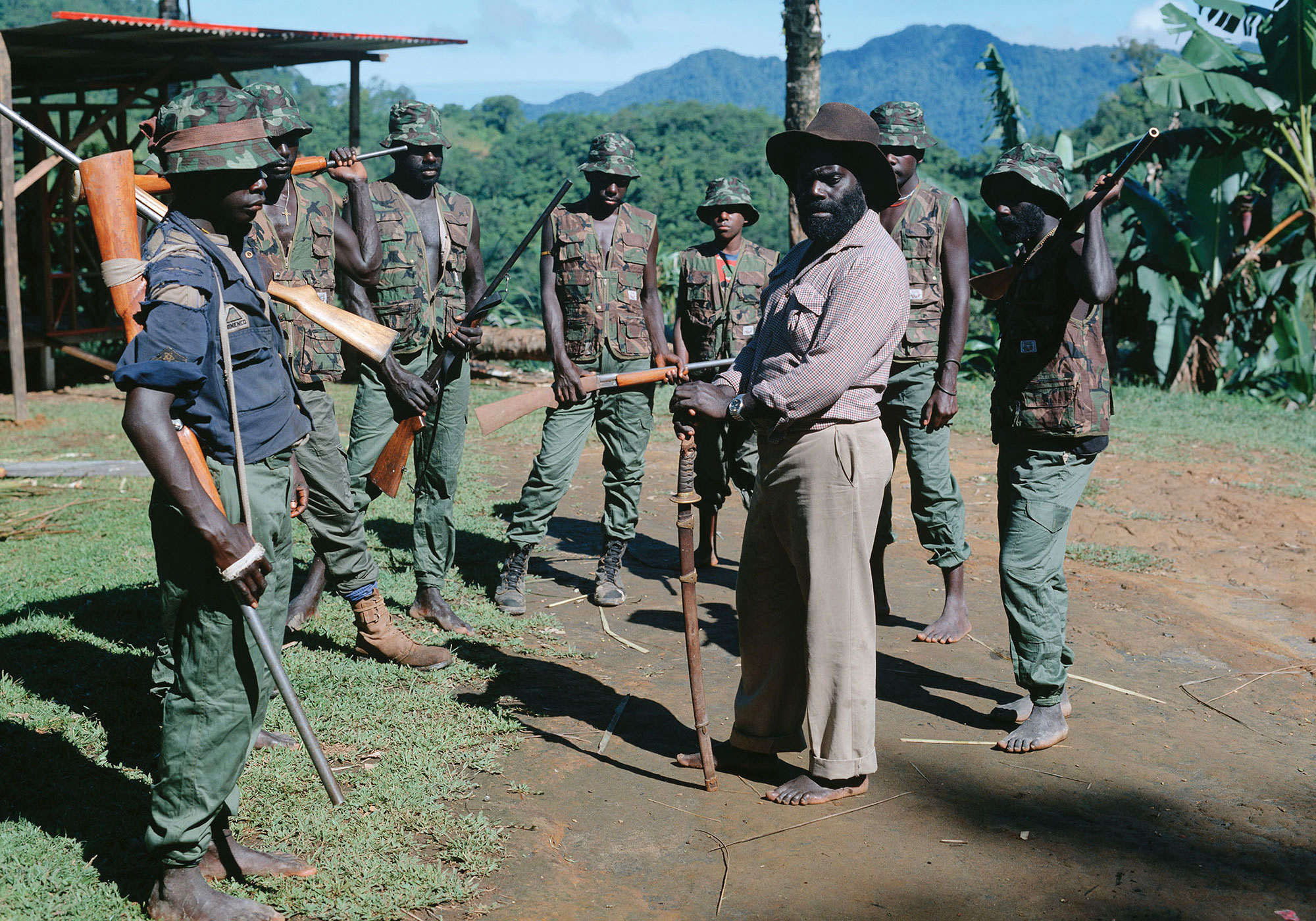 BRA leader Francis Ona (holding a samurai sword) and some of his men at Guava village, 1994. Photographer: Ben Bohane. Collection of the Australian War Memorial.