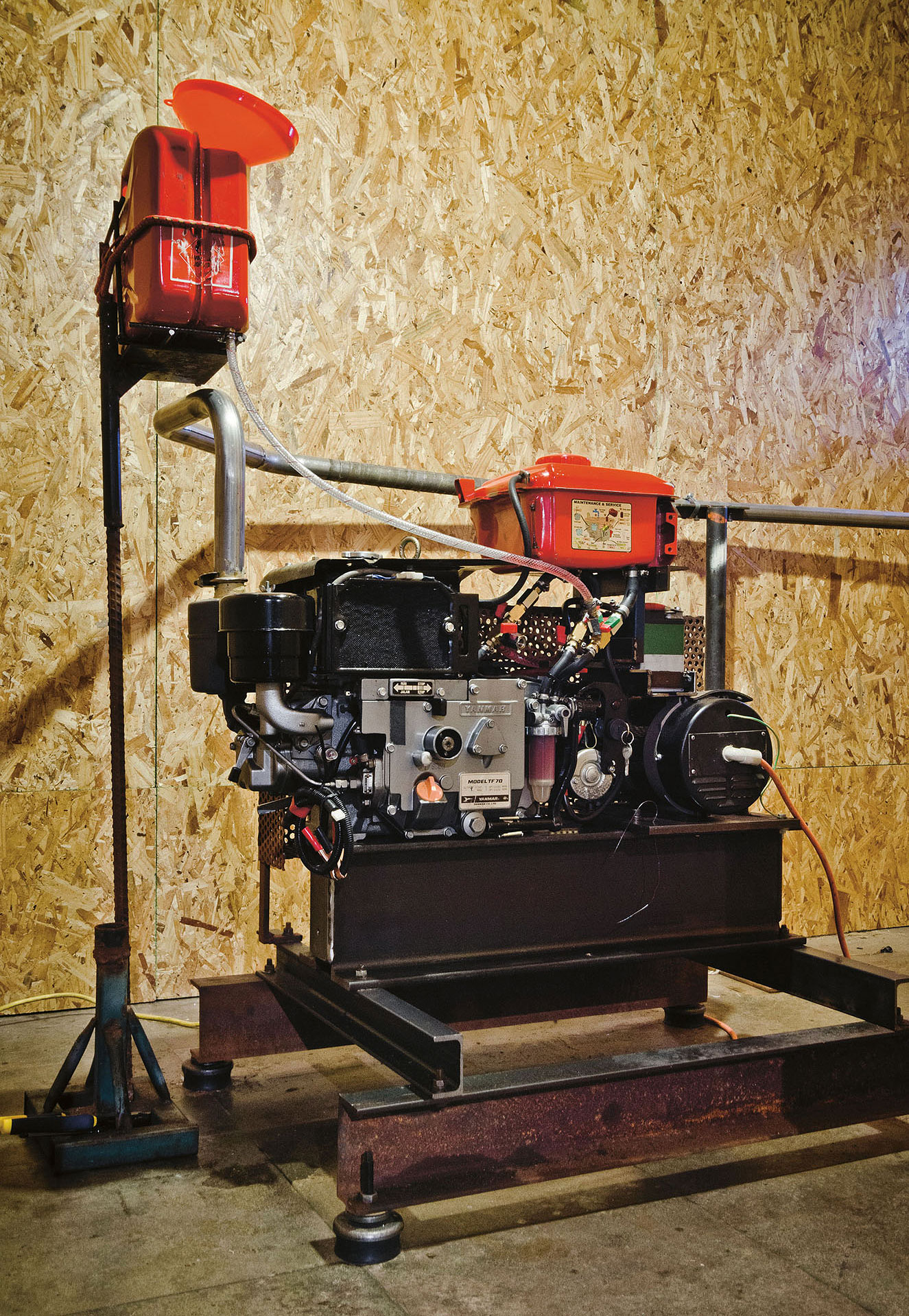 Nicholas Mangan, *Progress in Action*, 2013 (coconut-powered generator). Installation detail, 9th *Mercosul Biennial*, Porto Alegre, 2013. Photographer: Anderson Astor.