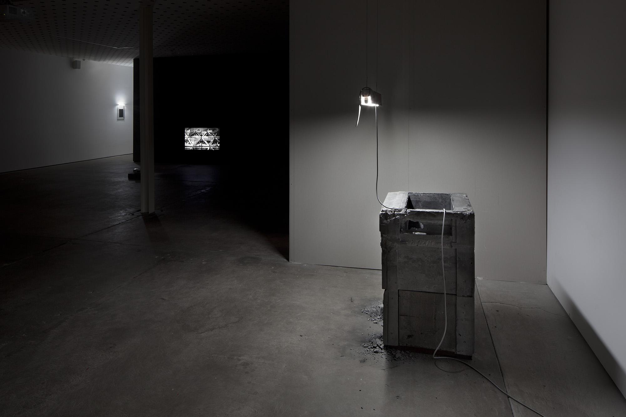 _Some Kinds of Duration_, 2011. Installation View, CCP - Centre for Contemporary Photography, Melbourne Australia, 2012. HD video colour, silent, concrete, fluorescent light, steel, carbon.