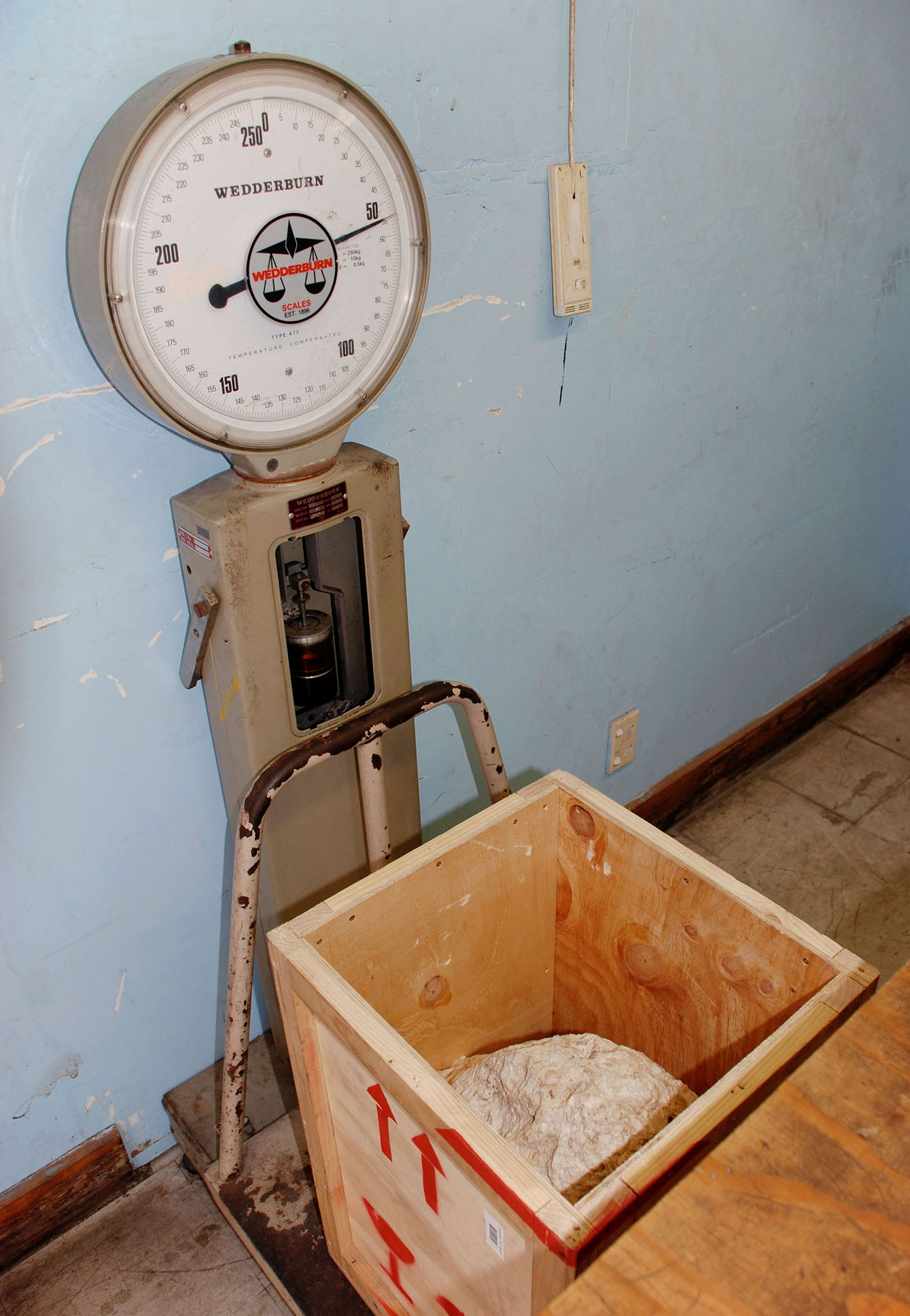 Coral limestone sample being weighed at Nauru International Airport in Boe, Nauru prior to departure, 2009. Photographer: Nicholas Mangan.